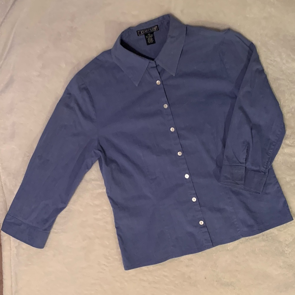 HAROLDS woman’s buttoned down shirt.